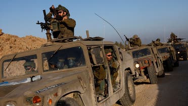 Israeli soldiers prepare to enter Gaza, amid the ongoing conflict between Israel and the Palestinian group Hamas, on the Israeli side of the Israel-Gaza border, December 11, 2023. (Reuters)