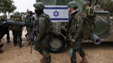 Israeli soldiers prepare to enter the Gaza Strip, amid the ongoing conflict between Israel and Hamas, at Israel’s border with Gaza in southern Israel, December 13, 2023. (Reuters)
