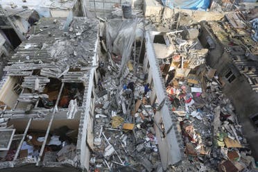 A Palestinian looks at destruction after an Israeli strike on residential buildings in Rafah, Gaza Strip, on Thursday, Dec. 14, 2023. (AP)