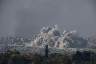 Smoke and debris rises after an Israeli airstrike in central Gaza, December 11, 2023. (Reuters)