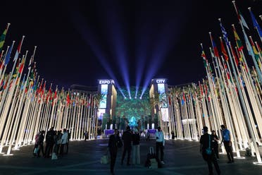 People walk outside Expo City in Dubai on December 12, 2023 during the United Nations Climate Change Conference COP28. (AFP)