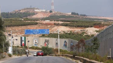 Vehicles drive in Kfar Kila village near the border with Israel, southern Lebanon, October 8, 2023. (Reuters)
