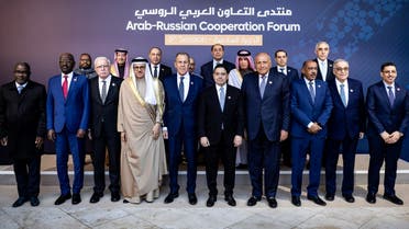 Russia's Foreign Minister Sergei Lavrov (C-L) poses for a picture with participants in the 6th session of the Arab-Russian cooperation Forum on December 20,2023 in Marrakesh. (Photo by FADEL SENNA / AFP)