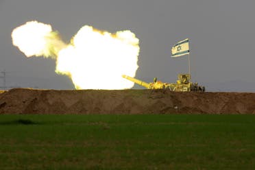 An Israeli mobile artillery unit fires a shell from southern Israel towards the Gaza Strip, in a position near the Israel-Gaza border, December 21, 2023. (AP)