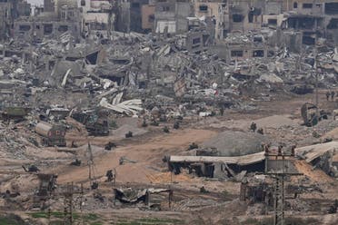 Israeli troops take positions in the Gaza Strip as seen from southern Israel, December 21, 2023. (AP)