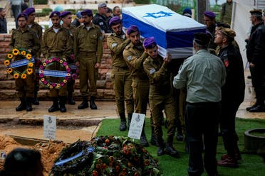 Israeli soldiers carry the flag-draped casket of Staff Sgt. Birhanu Kassie during his funeral at Mt. Herzl military cemetery in Jerusalem, December 24, 2023. Kassie, 22, was killed during Israel’s ground operation in the Gaza Strip. (AP)