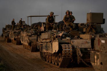 A convoy of Israeli army armored personnel carriers (APC) is seen near the Israeli-Gaza border, in southern Israel, December 25, 2023. (AP)