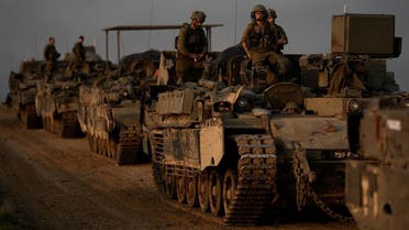A convoy of Israeli army armored personnel carriers (APC) is seen near the Israeli-Gaza border, in southern Israel, December 25, 2023. (AP)