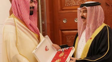 King Hamad conferinng the Order of Bahrain-First Class on outgoing Saudi Ambassador Prince Sultan bin Ahmed on Sunday. (SPA)
