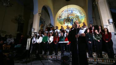 Syrians sing christmas songs at a church in the capital Damascus. (AFP)