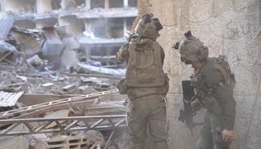 Israeli soldiers operate in a location given as Tuffah, Gaza, amid the ongoing conflict between Israel and Hamas, in this screen grab taken from a handout video obtained on December 26, 2023. (Handout via Reuters)