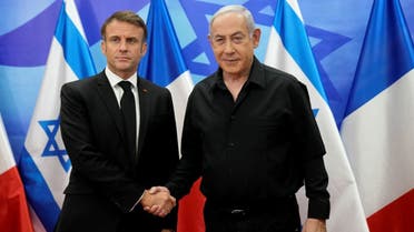Israeli Prime Minister Benjamin Netanyahu, right, welcomes French President Emmanuel Macron before their talks in Jerusalem, Tuesday, Oct. 24, 2023. (File photo: Reuters)