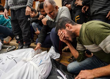 Palestinians mourn relatives killed in Israeli strike at Al-Nasser Hospital in Khan Younis on the southern Gaza Strip on December 28, 2023. (AFP) Palestinians, wounded in an Israeli strike, receive treatment at Al-Nasser Hospital in Khan Younis on the southern Gaza Strip on December 28, 2023. (AFP)