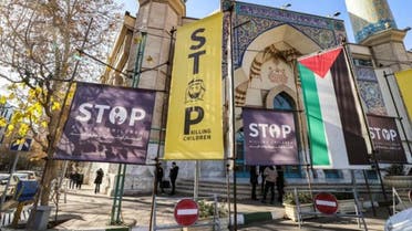 Banners condemning Israel and calling for an end to the conflict in the Gaza Strip hang outside a mosque along a street in Tehran. (AFP)