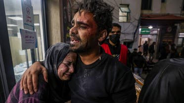 Victims of an Israeli army strike react outside of Kuwait hospital in Rafah in the southern Gaza Strip on December 28, 2023, as battles continue between Israel and Hamas. (AFP)