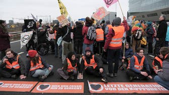 Extinction Rebellion climate activists block Amsterdam highway in protest against ING
