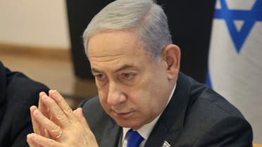 Israeli Prime Minister Benjamin Netanyahu chairs a cabinet meeting at the Kirya, which houses the Israeli Ministry of Defence, in Tel Aviv, Israel, Sunday, Dec. 17, 2023. (Menahem Kahana/Pool Photo via AP)
