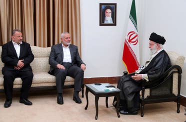 In this photo released by an official website of the office of the Iranian supreme leader, Supreme Leader Ali Khamenei, right, meets with the leader of the Palestinian militant group Hamas, Ismail Haniyeh, center, and his deputy Saleh al-Arouri in Tehran, Iran, June 21, 2023. (AP)