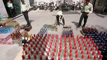 Iranian police prepare to destroy confiscated bottles of alcohol in Tehran. The possession, production and consumption of alcohol is strictly forbidden in the Islamic Republic. (AFP/File)