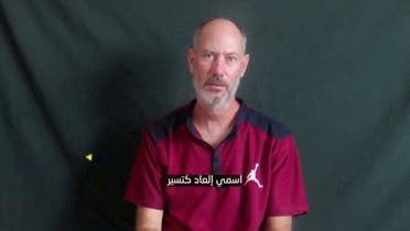 Elad Katzir, 47, who was taken hostage on October 7 during the deadly attack by the Palestinian militia group Hamas, speaks in an unknown location in this screengrab taken from a handout video obtained on December 20, 2023. (Reuters)