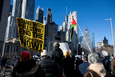 Pro-Palestinian protesters demonstrate on the Brooklyn bridge on January 8, 2024, in New York City. (AFP)