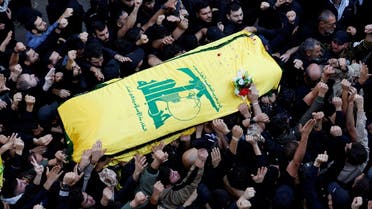 People carry the coffin of Hezbollah member Abbas Raad, senior Hezbollah figure and member of parliament Mohammad Raad's son, who was killed along with four fighters in what Hezbollah said was an Israeli strike on the village of Beit Yahoun in south Lebanon on Wednesday, during his funeral in the town of Jbaa, southern Lebanon November 23, 2023. REUTERS/Alaa Al-