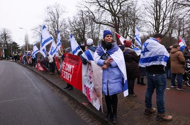 Pro-Israeli protesters gather near the International Court of Justice (ICJ) as judges hear a request for emergency measures by South Africa to order Israel to stop its military actions in Gaza, in The Hague, Netherlands, on January 12, 2024. (Reuters)