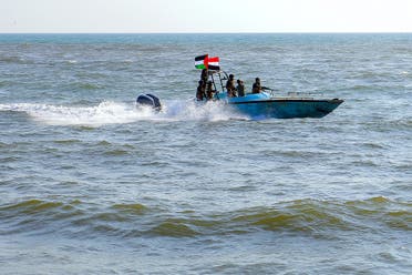 Members of the Yemeni Coast Guard affiliated with the Houthi group patrol the sea as demonstrators marched through the Red Sea port city of Hodeida in solidarity with the people of Gaza on January 4, 2024. (AFP)