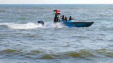 Members of the Yemeni Coast Guard affiliated with the Houthi group patrol the sea as demonstrators marched through the Red Sea port city of Hodeida in solidarity with the people of Gaza on January 4, 2024. (AFP)