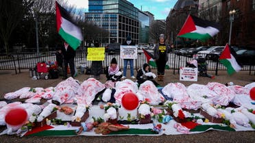Flags and balloons move in the wind as anti-war protesters demonstrate in support of Palestinians in Gaza, near the White House in Washington, U.S., December 11, 2023. (Reuters)