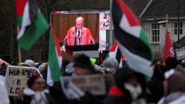 A view of a live broadcast displayed on a street as pro-Palestinian demonstrators protest near the International Court of Justice (ICJ) on the day judges hear a request for emergency measures to order Israel to stop its military actions in Gaza, in The Hague, Netherlands January 11, 2024. (Reuters)