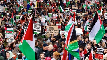 People take part in a protest to mark 100 days since the start of the ongoing conflict between Israel and Hamas in Gaza during a march in London, Britain, on January 13, 2024. (Reuters)