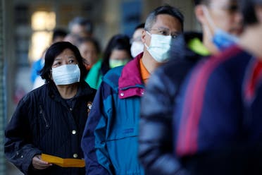 مواطنون في تايوان يصطفون أمام لجان الانتخابات للإدلاء بأصواتهم - رويترز