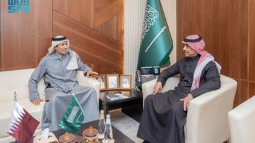 Saudi minister of media, Salman Al-Dosari, and the chair of Qatar Media Corporation, Sheikh Hamad bin Thamer, talk about ways to enhance media cooperation between their nations in Riyadh. (SPA)