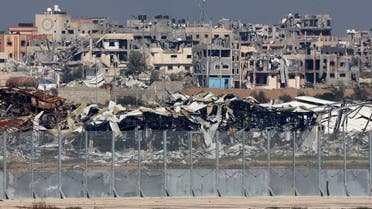 A picture taken from a position in southern Israel on January 19, 2024, shows damaged or levelled buildings in the Gaza Strip amid continuing battles between Israel and Hamas. (AFP)