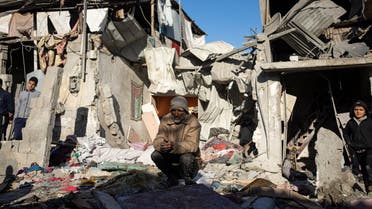 Palestinians look at the destruction after an Israeli strike in Rafah, southern Gaza Strip, on January 18, 2024. (AP)