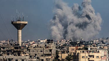 This picture taken on January 18, 2024 from Rafah shows smoke billowing over Khan Yunis in the southern Gaza Strip during Israeli bombardment, amid ongoing battles between Israel and the Palestinian militant group Hamas. (Photo by AFP)