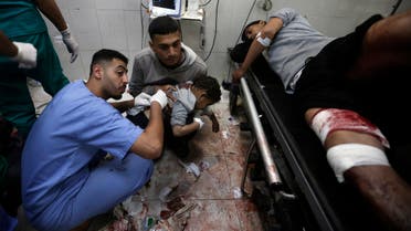 Palestinians wounded in the Israeli bombardment of the Gaza Strip receive treatment at the Nasser hospital in Khan Younis, Southern Gaza Strip, Monday, Jan. 22, 2024. (AP Photo/Mohammed Dahman)