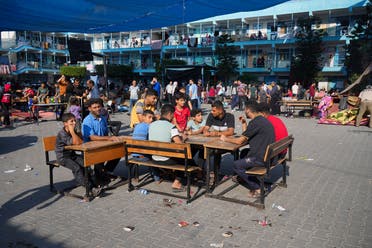 Palestinians take shelter in a UN-run school from the ongoing Israeli strikes on the Gaza Strip in Nuiserat refugee camp on Saturday, October 14, 2023. (File photo: AP)