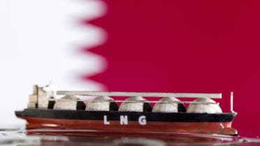 FILE PHOTO: Model of LNG tanker is seen in front of Qatar's flag in this illustration taken May 19, 2022. REUTERS/Dado Ruvic/Illustration/File Photo