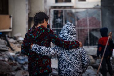 Children embrace as people inspect the damage following Israeli bombardment in Rafah on the southern Gaza Strip on December 29, 2023, amid the ongoing battles between Israel and the Palestinian militant group Hamas. (File photo: AFP)