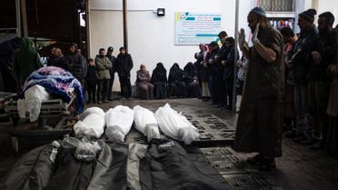 Palestinians pray next to the bodies of those who were killed in the Israeli ground offensive and bombardment of Khan Younis, outside a morgue in Rafah, southern Gaza, Wednesday, Jan. 24, 2024. Efforts to reach a new cease-fire between Israel and Hamas appear to be gaining steam. Any deal would have to include a pause in fighting, an exchange of hostages held by Hamas for Palestinian prisoners held by Israel and large quantities of desperately needed humanitarian assistance for the war-battered Gaza Strip. But finding a formula acceptable to both sides has been elusive. The gaps between Israel and Hamas remain wide, and the chances of an agreement anytime soon still appear to be slim. (AP Photo/Fatima Shbair)