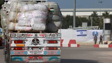 An Egyptian truck carrying humanitarian aid undergoes security checks at the Israeli side of the Kerem Shalom border crossing before entering the southern Gaza Strip, on January 22, 2024, amid the ongoing conflict between Israel and Hamas. (AFP)