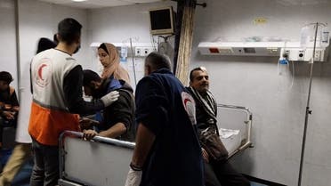 Injured Palestinian people receive medical assistance at Al-Amal Hospital, amid the ongoing conflict between Israel and the Palestinian Islamist group Hamas, in Khan Younis, Gaza Strip, in this handout image released on January 23, 2024. (Reuters)
