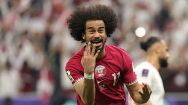 Qatar’s forward #11 Akram Afif celebrates after scoring his third goal from a penalty shot during the AFC Qatar 2023 Asian Cup final football match between Jordan and Qatar at the Lusail Stadium in Lusail, north of Doha on February 10, 2024. (AFP)