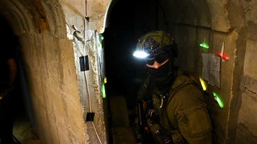 An Israeli soldier stands in what the military described as a Hamas command tunnel running partly under UNRWA headquarters, amid the ongoing conflict between Israel and the Palestinian Islamist group Hamas, in the Gaza Strip, February 8, 2024. REUTERS/Dylan Martinez EDITOR'S NOTE: REUTERS PHOTOGRAPHS WERE REVIEWED BY THE IDF AS PART OF THE CONDITIONS OF THE EMBED. NO PHOTOS WERE REMOVED