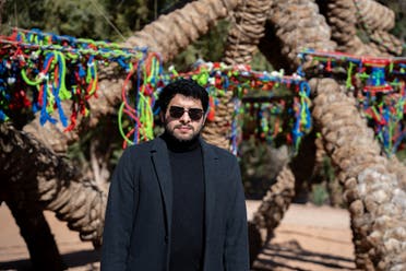 Obaid Alsafi, winner of the 6th edition of the Ithra Art Prize in collaboration with Arts AlUla, with his work Palms in Eternal Embrace at AlUla Arts Festival. (Supplied)