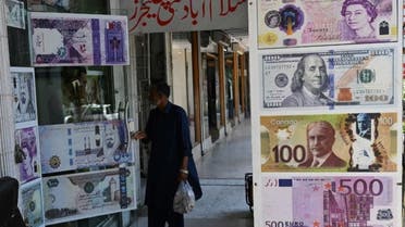 A man enters a foreign currency exchange shop in Islamabad on July 11, 2023. (AFP/File)