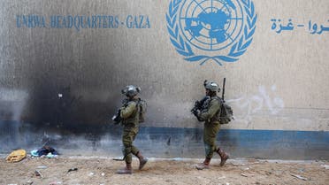 A picture taken during a media tour organized by the Israeli army on February 8, 2024, shows Israeli soldiers inside an evacuated compound of UNRWA in Gaza City. (AFP)