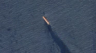 In this satellite image provided by Planet Labs, the Belize-flagged bulk carrier Rubymar is seen in the southern Red Sea near the Bay el-Mandeb Strait leaking oil after an attack by Yemen's Houthis Tuesday, Feb. 20, 2024. (AP)